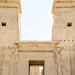 Tourist walking throuhg the Temple of Philae on an island in Lake Nasser, Nile River