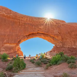 Tourists visiting North Window Arch, Arches National Park, Utah, USA Tourists visiting North Window Arch, Arches National Park, Utah, USA