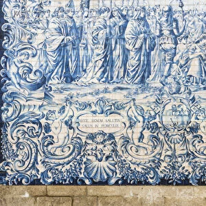 Traditional azulejos hand-painted tiles covering the exterior wall of the Igreja dos