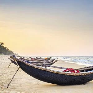 Traditional bamboo basket fishing boats on the beach at sunset, Thuan An Beach, Phu