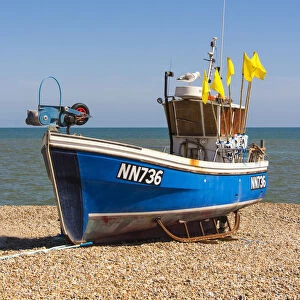 A traditional fishing boat on the shingle beach at Hastings, Sussex, England