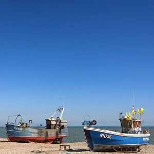 Traditional fishing boats on the shingle beach at Hastings, Sussex, England