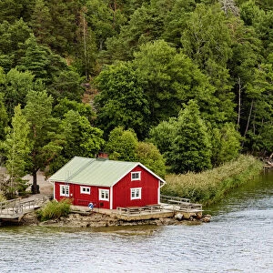 Traditional red house on the coast, Turku, Finland