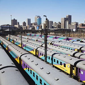 Train carriages at Park Station with city skyline in background, Johannesburg, Gauteng
