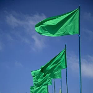 Tripoli, Libya; Libyan flags prominently displayed on Green Square in front of the entrance to the old Medina