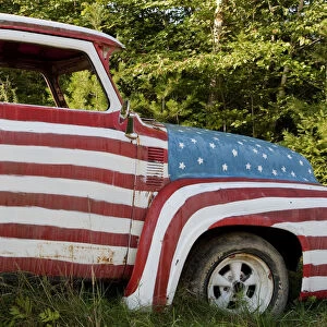A truck painted with the US flag on a roadside in New Hampshire, USA