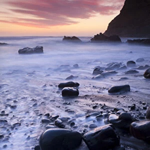 Twilight on the rocky beach at Duckpool on the North Cornish Coastline, Cornwall, England