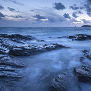 Twilight over Trevose Head from the rocky shores of Treyarnon Point, Cornwall, England