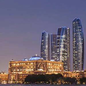 UAE, Abu Dhabi, Etihad Towers and Emirates Palace Hotel, dusk