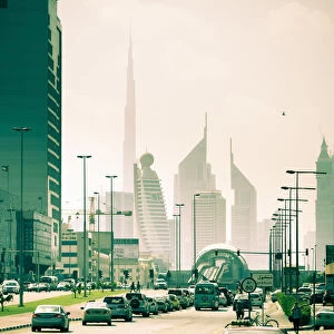 UAE, Dubai, Trade Centre Road, Burj Khalifa and Emirates Towers with Al Karama Metro