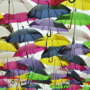 Umbrella Sky Project in the streets of Agueda, by Sextafeira Producoes. Portugal