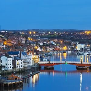 United Kingdom, England, North Yorkshire, Whitby. The harbour at dusk
