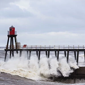 United Kingdom, England, North Yorkshire, Whitby. The East Pier during a Winter storm