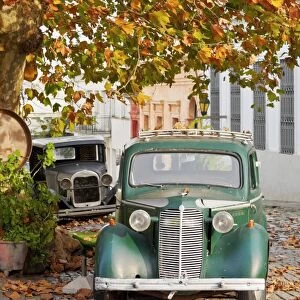 Uruguay, Colonia Department, Colonia del Sacramento, Vintage cars on the cobblestone