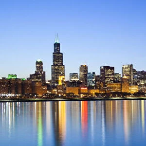 USA, Illinois, Chicago. Dusk view of the skyline from Lake Michigan