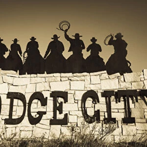 USA, Kansas, Dodge City, city sign with cowboy silhouettes