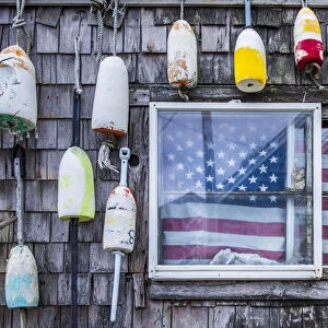 USA, Massachusetts, Cape Ann, Rockport, lobster buoys and US flag