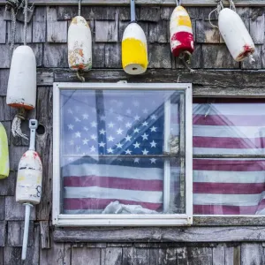 USA, Massachusetts, Cape Ann, Rockport, lobster buoys and US flag USA, Massachusetts, Cape Ann, Rockport, lobster buoys and US flag