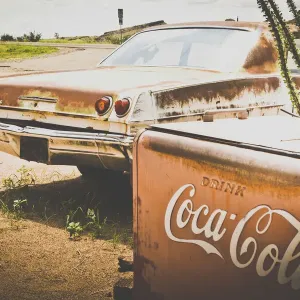 USA, Route 66, details of an old rugged Coca Cola fridge and car, vintage processing USA, Route 66, details of an old rugged Coca Cola fridge and car, vintage processing