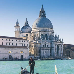 Venice, Veneto, Italy. Gondola over the Grand Canal with the Salute (St Mary of Health)