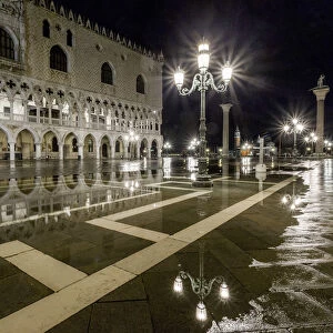 Venice, Veneto, Italy. High water on San Marco Square and Palazzo Ducale on the left