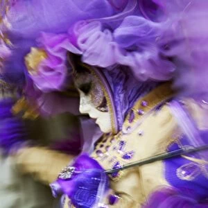 Venice, Veneto, Italy; A mask in movement on Piazza San Marco during Carnival