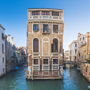 Venice, Veneto, Italy. Palace on a narrow canal