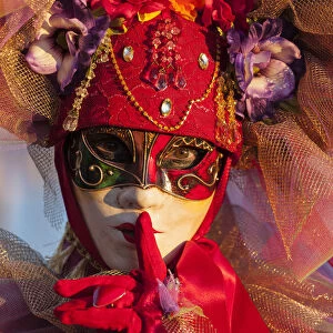 Venice, Veneto, Italy. A traditional mask at Venice Carnival, one of the oldest Carnival