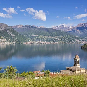 View of the bell tower and village of Dorio surrounded by Lake Como Province of Lecco