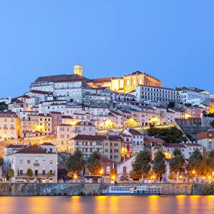 View of Coimbra ol town and Mondego River at dusk. Coimbra, Coimbra district