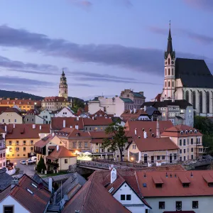 View of historic center of Cesky Krumlov dominated by St. Vitus Church at dusk, Cesky Krumlov, South Bohemian Region, Czech Republic