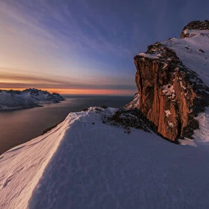 View from Mt. Hesten, above the fjord during a winter sunset, Senja island, Norway