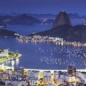 View of Sugar Loaf Mountain (Pao do Acucar) and Botafogo Bay at dusk, Rio de Janeiro