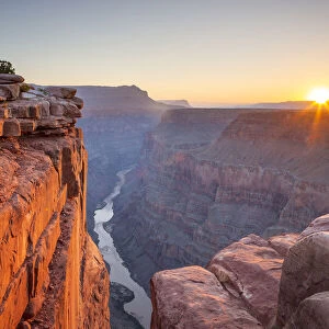 View of the sun rising over the Grand Canyon and Colorado River