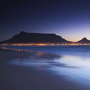View of Table Mountain at dusk from Milnerton beach, Cape Town, Western Cape, South