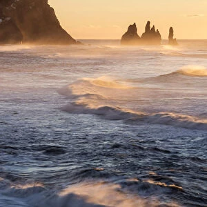 Vik, Southern Iceland, Europe. The rock formations of Reynisdrangar and ocean waves