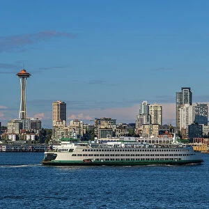 Washington State Ferry with downtown skyline and Space Needle behind, Seattle, Washington, USA