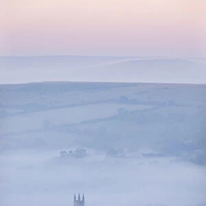 Widecombe-in-the-Moor Church surrounded by mist at dawn, Dartmoor National Park, Devon