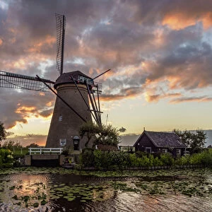 Windmill in Kinderdijk at sunset, UNESCO World Heritage Site, South Holland, The
