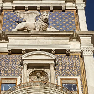The winged lion of Saint Mark at The Clock Tower in the Piazza San Marco, Venice, Veneto
