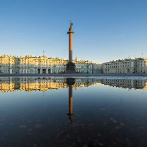 Winter Palace and Alexander Column reflecting on a pond after the rain in Palace Square