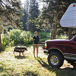 Woman next to her caravan along Nez Perce pass, Idaho, USA, MR