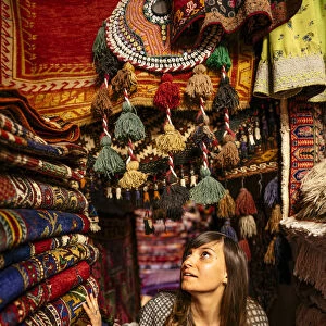 Woman in a carpet market shop in Goreme, Cappadocia, Central Anatolia, Turkey. (MR)