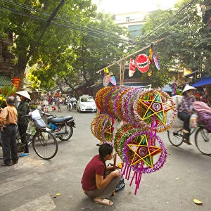 Woman selling decorations for the Mid Autumn moon festival, Old Quarter, Hanoi, Vietnam