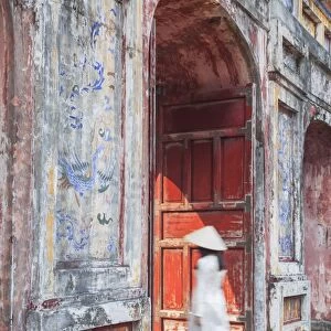 Woman wearing Ao Dai dress at Dien Tho inside Citadel, Hue, Thua Thien-Hue, Vietnam (MR)