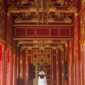 Woman wearing Ao Dai dress in Imperial Palace inside Citadel, Hue, Thua Thien-Hue Woman wearing Ao Dai dress in Imperial Palace inside Citadel, Hue, Thua Thien-Hue