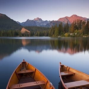 Wooden boats on Strbske Pleso lake in the Tatra Mountains of Slovakia, Europe. Autumn
