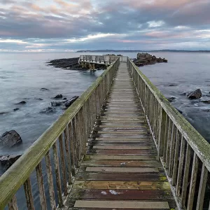 Wooden bridge at Ballycastle Beach on the Causeway Coast, Ballycastle, County Antrim, Northern Ireland. Autumn (November) 2022