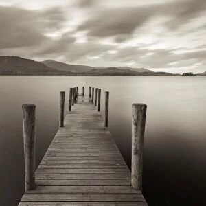 Wooden jetty on Derwent Water in the Lake District, Cumbria, England. Autumn