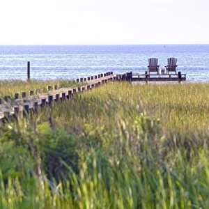 Wooden pier and chairs, Apalachicola Bay, Florida Panhandle, USA